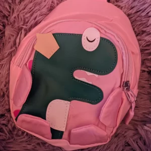 DINO CROSS ROSA INFANTIL